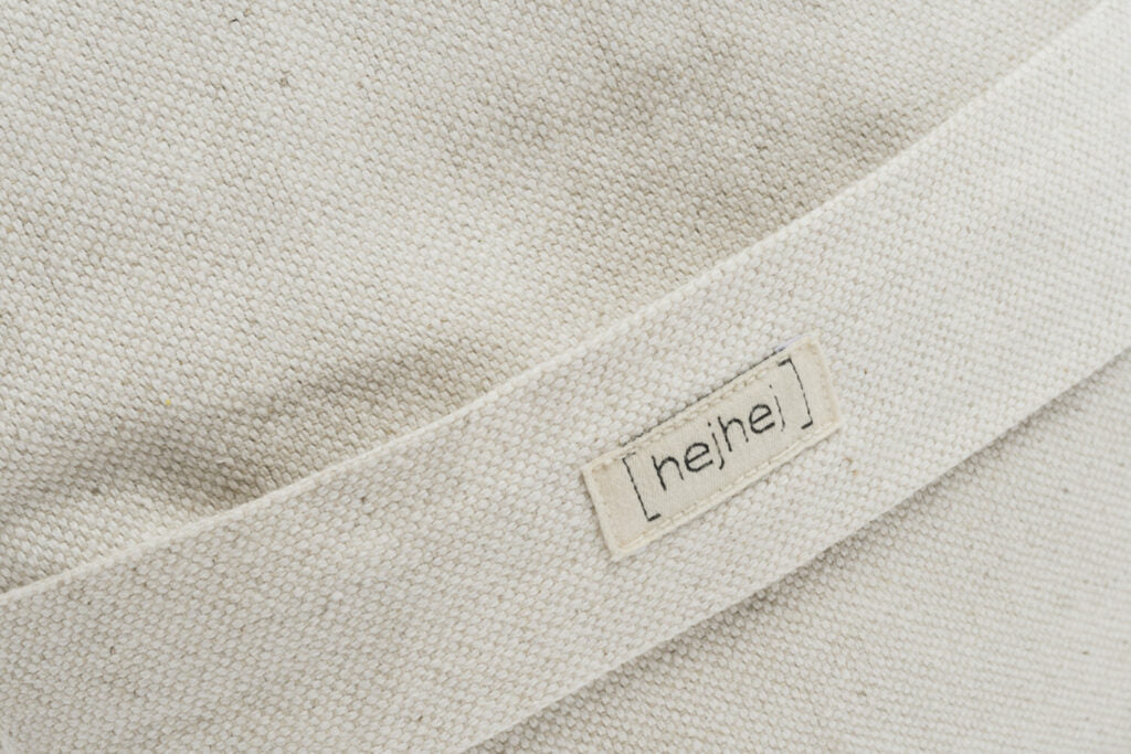 Detail of hejhej-logo with the structure of the soft fabric