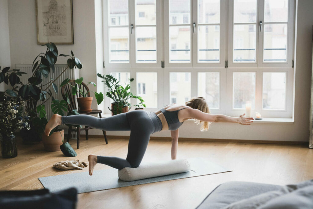 Blond girl balancing on the hejhej-bolster