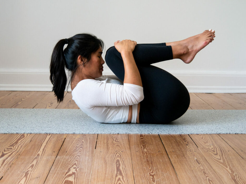 A woman curls up very small as a ball - this aids her digestion