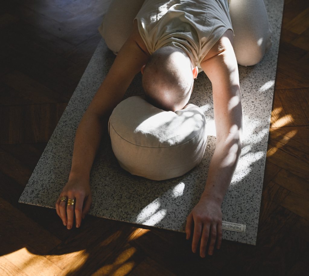 Child's pose with the head on the meditation pillow